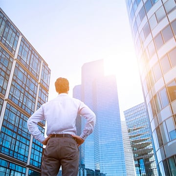 a business man looking at the sky